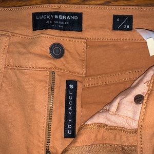 Lucky brand mid rise rust orange crop jeans